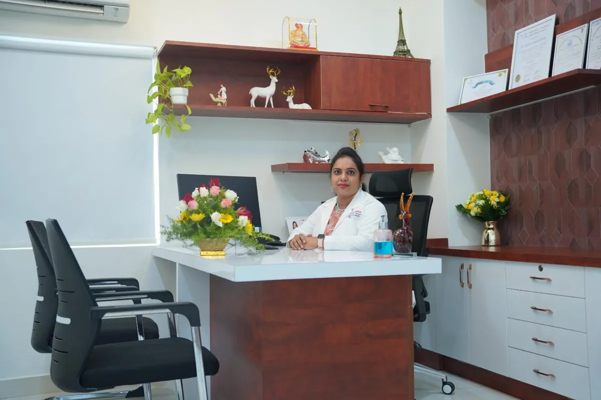 The consultation room at Elite Dental Clinic in Kondapur with a desk and seating